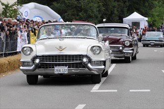 Two Cadillacs, one white and one dark red, at a classic car race, SOLITUDE REVIVAL 2011, Stuttgart,