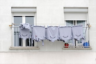 Marseille, Blue T-shirts on a washing line outside the window, Marseille, Departement