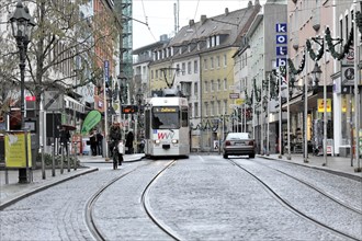 Wuerzburg, tram on rails crosses a city-forming scene in Wuerzburg, Wuerzburg, Lower Franconia,