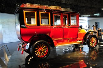 Historic red Mercedes-Benz bus from the early years of motor vehicle construction, Mercedes-Benz