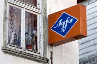 Cantilever sign, AGFA Film und Foto advertising sign, light box, abandoned photo shop, old window,