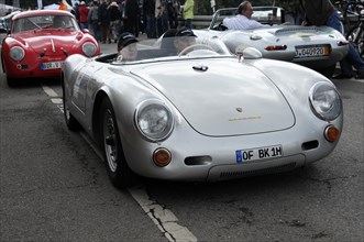 White racing car in classic design on a road with spectators around it, SOLITUDE REVIVAL 2011,
