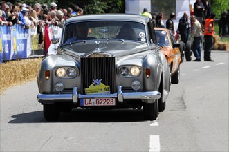 A grey Rolls-Royce drives on the road in a classic car race, SOLITUDE REVIVAL 2011, Stuttgart,