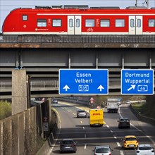 Regional train crosses the A535 motorway at Sonnborner Kreuz, motorway junction, Wuppertal, North