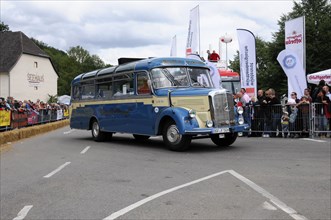 Mercedes-Benz O319, built in 1964, A vintage Mercedes-Benz bus in blue at a rally with an audience