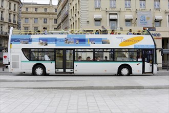 Marseille, sightseeing bus with passengers travelling through the city streets, Marseille,