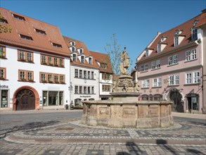 The main market square in the historic old town with the Schellenbrunnen fountain, Gotha,