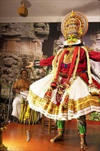 Kathakali performer or mime, 38 years old, and drummer on stage at the Kochi Kathakali Centre,