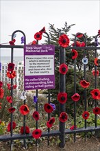 Sign, crocheted flowers, Road of Remembrance, Folkestone, Kent, Great Britain