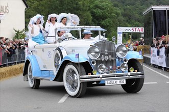 Cadillac Imperial Phaeton, built in 1930, A white Cadillac convertible with costumed woman drives