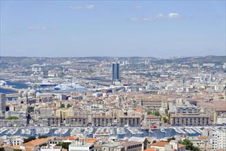 Aerial view of the harbour of Marseille, surrounded by urban development and the sea, Marseille,