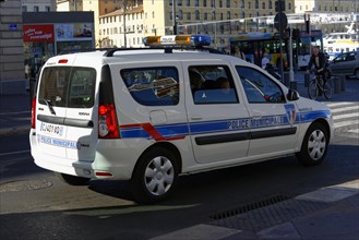 Police car parked on a city street in daylight, Marseille, Bouches-du-Rhone department,