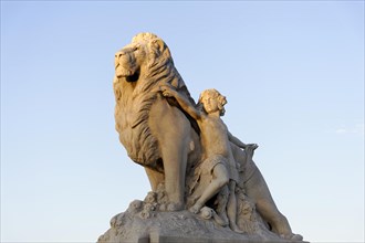 Statue of a lion with a figure against a blue sky, Marseille, Departement Bouches-du-Rhone, Region