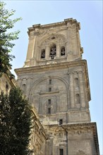 Granada, Church tower with historical architecture against the sky, Granada, Andalusia, Spain,