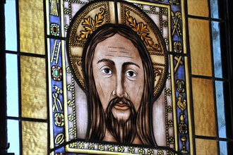 Castillo de Santa Catalina in Jaen, stained glass window showing Jesus with a serious facial