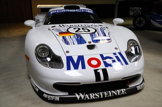 Deutsches Automuseum Langenburg, A white Porsche racing car with stickers and number 25 in a