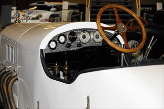 Deutsches Automuseum Langenburg, View into the cockpit of a white vintage racing car with wooden