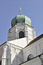 St Stephan Cathedral, Passau, church tower with green dome, cross at the top, under a blue sky, St