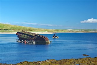 Parts of sunken ships sticking out of the water, Churchill Barriers, 2nd World War, Orkney Islands,