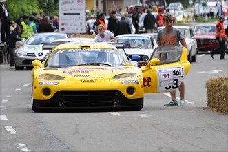 A vivid yellow modern racing car on the track, ready for the start, SOLITUDE REVIVAL 2011,