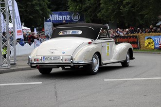 A white Mercedes cabriolet from behind at a classic car rally, SOLITUDE REVIVAL 2011, Stuttgart,