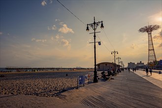 Sun sets on a warm summer day in Coney Island, Brooklyn, NY, USA, USA, North America