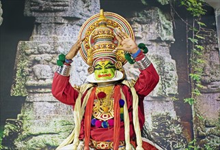 Kathakali performer or mime, 38 years old, on stage at the Kochi Kathakali Centre, Kochi, Kerala,