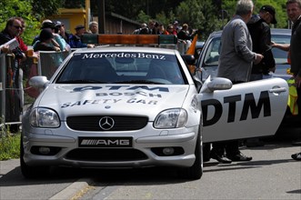A Mercedes-Benz AMG Safety Car stands on a race track in front of spectators, SOLITUDE REVIVAL