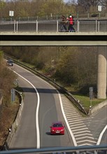 People crossing a pedestrian bridge at Sonnborner Kreuz, motorway junction, Wuppertal, North