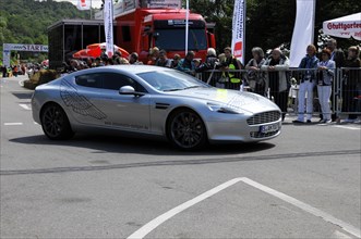 Aston Martin with gullwing design presents itself to spectators on a race track, SOLITUDE REVIVAL