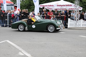A historic green vehicle at an outdoor racing event, SOLITUDE REVIVAL 2011, Stuttgart,