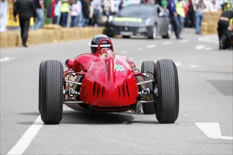 A historic racing car in front of an audience at a road race, SOLITUDE REVIVAL 2011, Stuttgart,