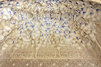Artistic stone carvings, Alhambra, Granada, The stucco ceiling of a historic building with