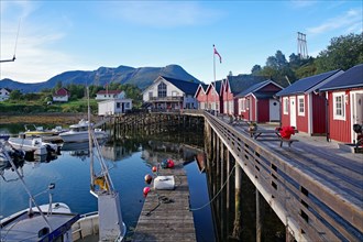 Wooden jetty with cosy wooden houses, fishing boats and benches, Rorbuer, holiday, fishing, Halsa,