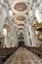 St Stephan Cathedral, Passau, Interior view of a baroque church with vaulted ceiling and frescoes,