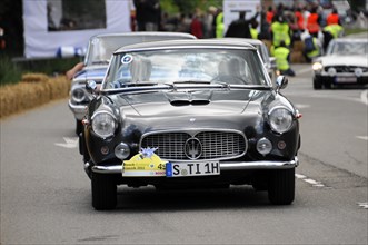 A classic blue Lancia drives on the road in a classic car race, SOLITUDE REVIVAL 2011, Stuttgart,