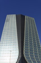 Marseille, CGA high-rise, Modern high-rise building with reflective glass facade under a blue sky,