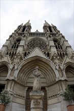 Church of Saint-Vincent-de-Paul, Detailed front view of a Gothic-style church facade with central