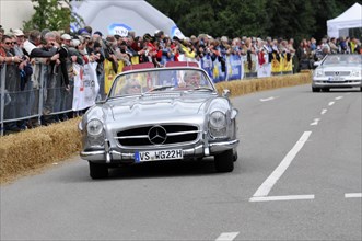 A silver Mercedes-Benz convertible classic car enjoys the attention at a rally, SOLITUDE REVIVAL