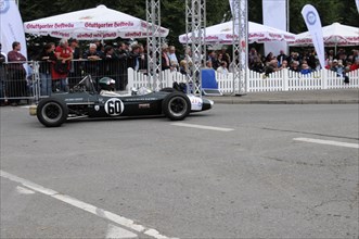 A classic black formula racing car with number 60 surrounded by spectators, SOLITUDE REVIVAL 2011,