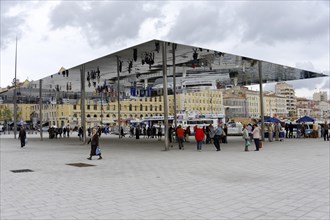 Marseille, People walking across a public square with a large reflective canopy, Marseille,