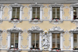 Facade view of the Falkenhaus with stucco facade in rococo style in the centre of Wuerzburg, rococo