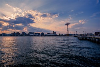 Sun sets on a warm summer day in Coney Island, Brooklyn, NY, USA, USA, North America