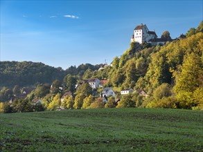 Egloffstein castle and village in the Trubach valley in autumn, Egloffstein, Upper Franconia,