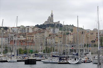 Marseille, Overview of the harbour of Marseille with sailing boats and city in the background,