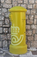 Solabrena, light yellow Spanish letterbox with symbols of the Spanish postal service, Andalusia,