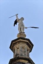 Granada, Statue with sword and wings on a column in front of a clear sky, Granada, Andalusia,