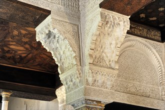Artistic stone carvings, Alhambra, Granada, Elaborate carvings on a ceiling showing traditional
