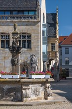 The wooden market fountain at the town hall with the Roland statue, Halberstadt, Saxony-Anhalt,