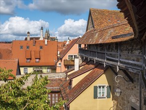 View from the battlements of the town wall to the houses and towers of the historic old town,